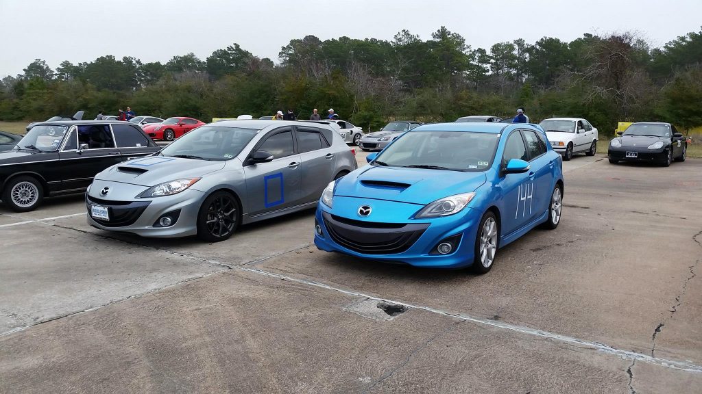 Preparation of the mazdaspeed 3 for autocross at my first motorsports event. Temporary numbers are put on with painter's tape.